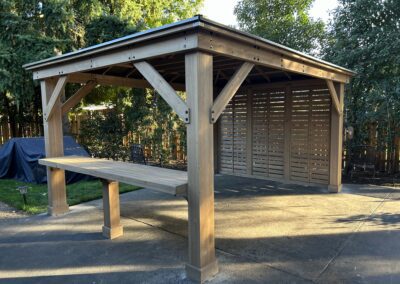 A backyard gazebo with a table and chairs